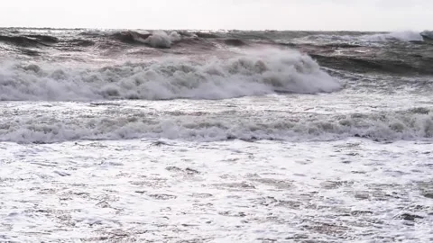 Slow motion. Extreme storm. The surface of the giant waves glistens in the rays Stock Footage 265941306