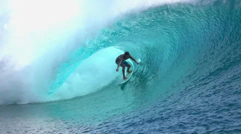 SLOW MOTION: Extreme surfer surfing inside big tube barrel wave Stock Footage