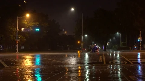 Slow motion Extreme wind and rain of Typhoon Nesat Traffic car and motorbike-Dan Stock Footage 78255078