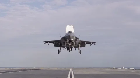 Slow motion F-35B vertical landing aboard Royal Navy HMS Prince of Wales (R09) Stock Footage 259036443