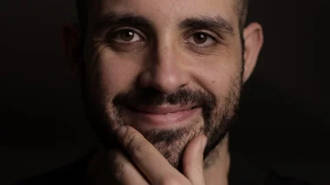 Slow motion: face portrait of a millennial man that smiles Stock Footage 149221538