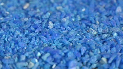 Slow motion of falling blue crystals gems salt meth Stock Footage 154135974