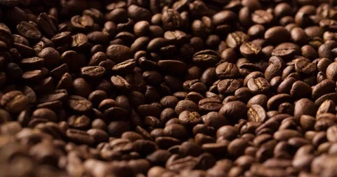 Slow Motion Falling Coffee Beans blurred background close up macro shot Stock Footage 98030633