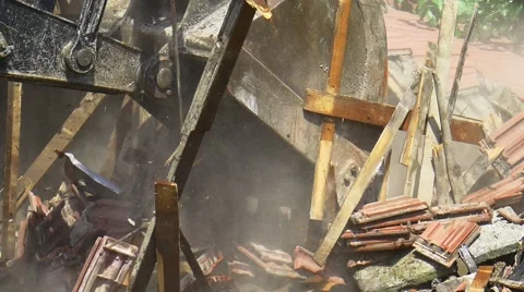 Slow motion of falling down broken roof tiles and planks during demolition of a Stock Footage 52441568