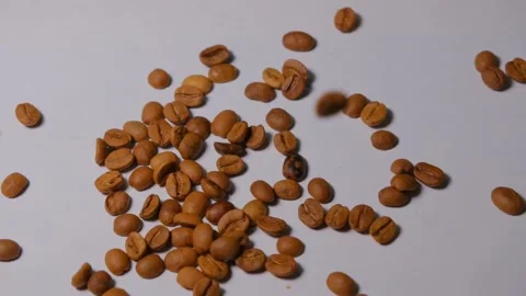 Slow motion falling down of coffee beans Video stock 166715739