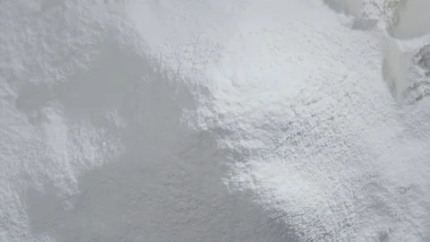 Slow motion of falling eggs into flour stock. Footage food. Egg dropping into Stock Footage 72892414