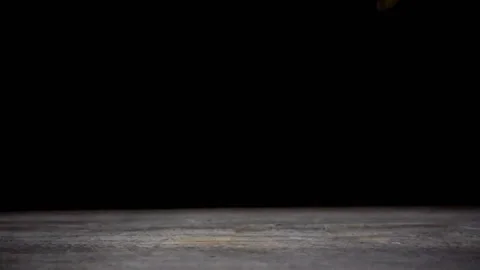 Slow motion of falling euro coins on wooden table on black background. Stock Footage 101496571