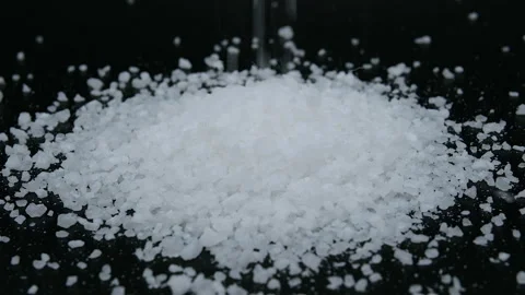 Slow motion of falling Kitchen salt grain,unhealty hypertensive,sodium chloride Stock Footage 197476951