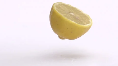 Slow motion falling lemon Stock Footage 33801736