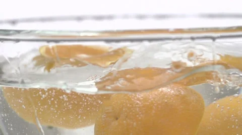 Slow motion falling orange in water Stock Footage 33801843