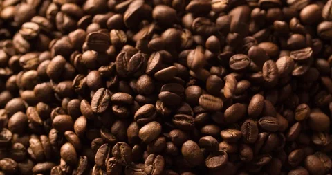 Slow Motion Falling Pouring Coffee Beans background close up macro Stock Footage 98242638