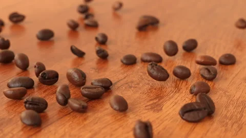 Slow Motion Falling Roasted Coffee Beans on Wooden Table Background  스톡 동영상 330802480