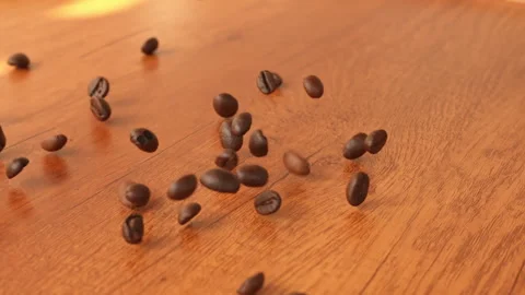 Slow Motion Falling Roasted Coffee Beans on Wooden Table Background 動画素材 330802924