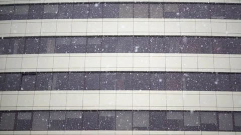 Slow Motion of Falling Snow on the background of a high-rise Building Stock Footage 83026694