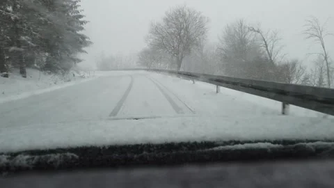 Slow-motion falling snow car ride Video stock 151863439