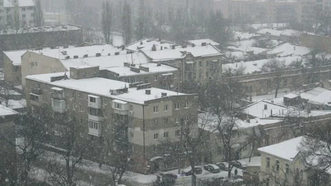 Slow motion of falling snow at the city. Nice winter background. Winter Stock Footage 87842595