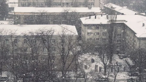 Slow motion of falling snow at the city. Nice winter background. Winter Stock Footage 88041632