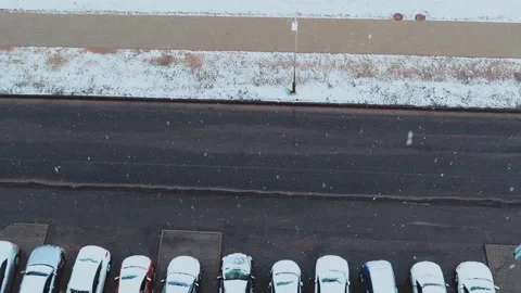 Slow motion of falling snow. Snow falls in the city, view from the window to Stock Footage 153103191