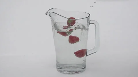 Slow motion falling strawberries Stock Footage 33802102