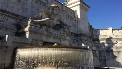 Slow motion of falling water and pigeons sitting on an old fountain in the Stock Footage 270678415
