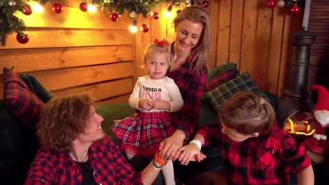 Slow Motion Family dad, mom, daughter and son on the New Year background. Stock Footage 166322699