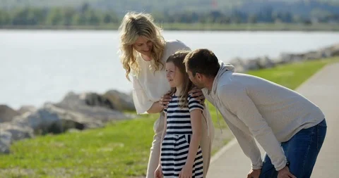 Slow Motion Of Family Talking About Their Next Holiday Destination Stock Footage 123735392