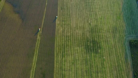 Slow motion. Farmer machine is working on a wheat field, harvesting. 4K. Stock Footage 115324732