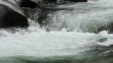 Slow motion of a fast running mountain river, Gargantos de los Infiernos Stock Footage 133641960