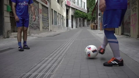 Slow motion of feet of group of two football players Stock Footage 167842009