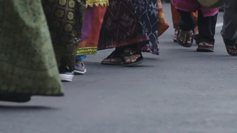 Slow motion of feet walking through a street in Nepal Video stock 95613899