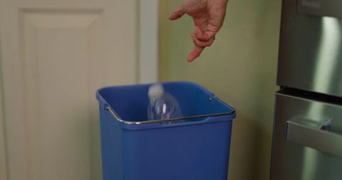 Slow Motion Female Hand Throwing Plastic Water Bottle in Recycling Bin 2 Stock Footage 243851337
