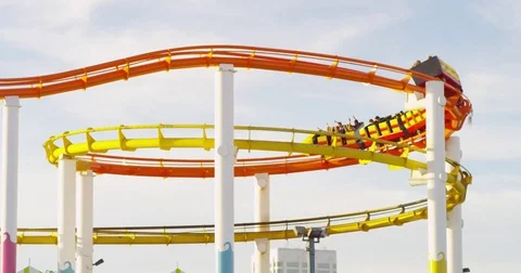 Slow motion of the Ferris Wheel and roller coaster at Santa Monica Pier. Stock Footage 73415445