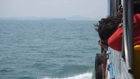 Slow Motion of Ferry Driving in Ocean and People Leaning At Railing Stock Footage 126086299
