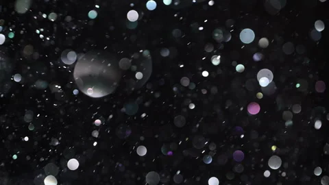 Slow-motion festive snow particles with bokeh and winter sparkle. Vídeo Stock 322800383