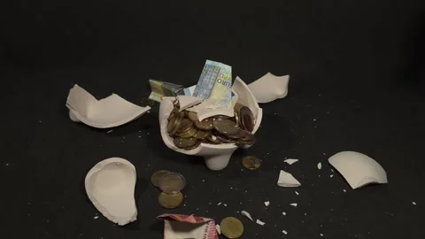 Slow motion with the final blow that destroys the piggy bank, with Euros an.. Stock Footage 320081176