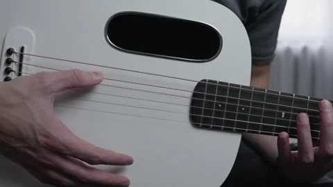 Slow Motion Finger Strumming Acoustic Guitar Strings Front View Stock Footage 330118009
