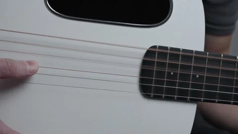 Slow Motion Finger Touching Acoustic Guitar Strings Stock Footage 330118656