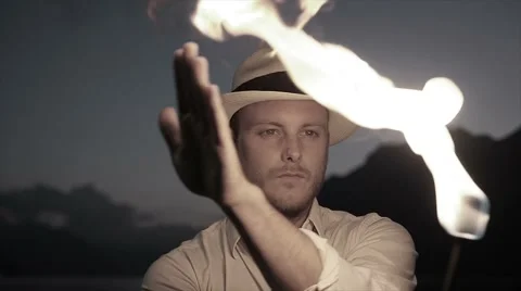 Slow motion of fire artist performing light show with torchlight at night Stock Footage 42948457