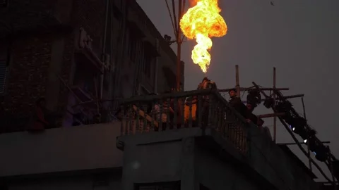 Slow motion fire breathing in Old Dhaka Video stock 152880176