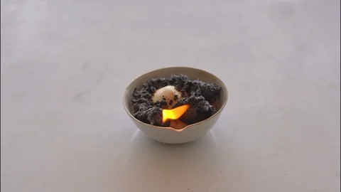 Slow motion fire burning chemical reagent in crucible on white table 库存影片 111485246