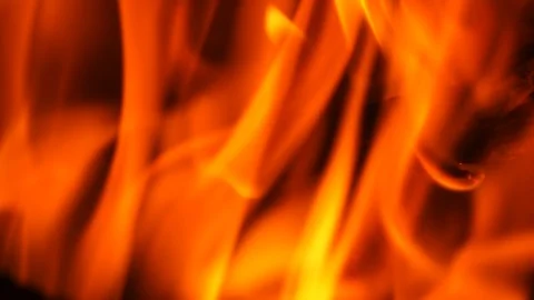 Slow motion fire burning with dark orange and red flames on black background Stock Footage 96430912