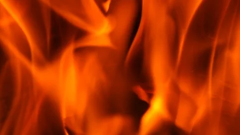 Slow motion fire burning with dark orange and red flames on black background Stock Footage 96430968
