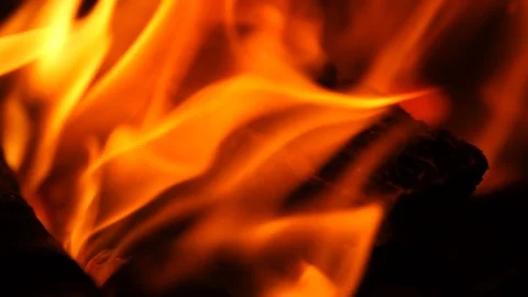 Slow motion fire burning with dark orange and red flames on black background Stock Footage 96430970