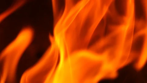 Slow motion fire burning with dark orange and red flames on black background Stock Footage 96430971
