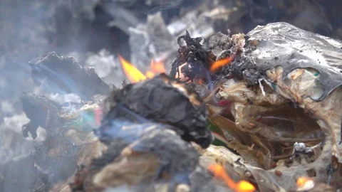 Slow motion fire flame and smoke burning on garbage on dark background Stock Footage 100336314
