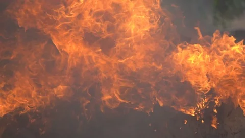 Slow motion fire flame burning, hot and danger orange flame and smoke glowing Видео 112349497