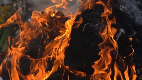 Slow motion fire flame burning, hot and danger orange flame and smoke glowing Видео 112352602