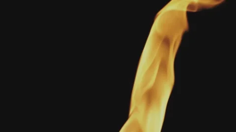 Slow motion fire flame dancing against dark background in studio with orang.. Stock Footage 337404288