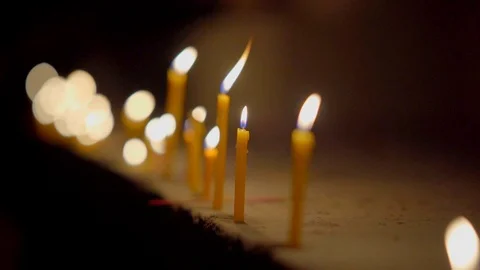 Slow motion fire flame glowing of burn candle in dark background Stock Footage 112581255