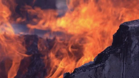 Slow motion fire flame glowing and cement wall Video stock 116913184